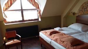 Letto o letti in una camera di Hotel Vinopa