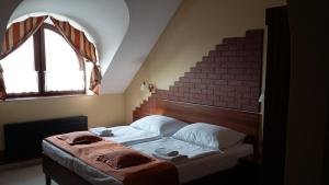 Letto o letti in una camera di Hotel Vinopa
