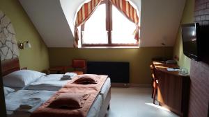 Letto o letti in una camera di Hotel Vinopa