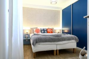 En eller flere senger på et rom på Feel Nazaré - Ocean View