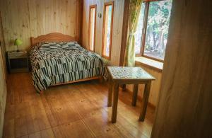 Ένα ή περισσότερα κρεβάτια σε δωμάτιο στο Llaima Camp