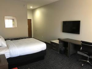 Un pat sau paturi într-o cameră la Hotel Glenpool