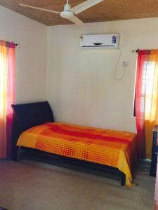 A bed or beds in a room at Munroe Eco Camp