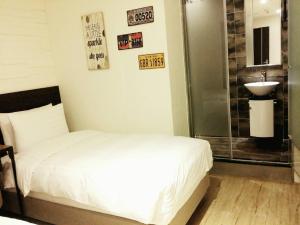 Postel nebo postele na pokoji v ubytování Re-Change Hotel Taipei