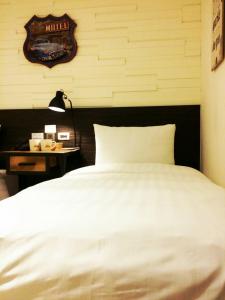 Postel nebo postele na pokoji v ubytování Re-Change Hotel Taipei