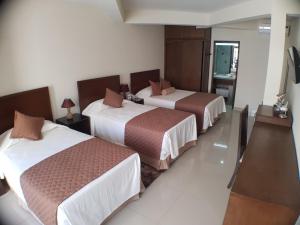 Un pat sau paturi într-o cameră la Hotel Boutique Casamagna