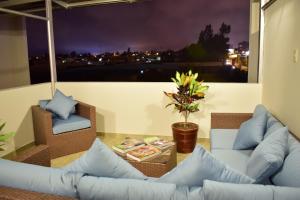 a living room with a couch and a table at Posada La Merced in Arequipa