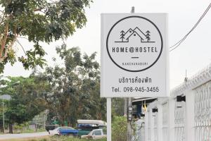 a sign for a homeostasis in front of a building at HOME@HOSTEL KANCHANABURI in Kanchanaburi