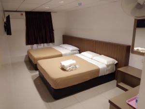 Cama o camas de una habitación en Comfort Two Hotel