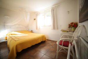 Postel nebo postele na pokoji v ubytování B&B Le clos des vignes Saint Raphael