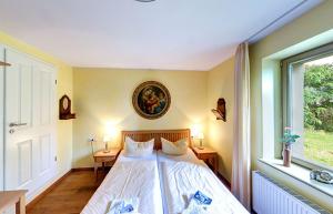 Ein Bett oder Betten in einem Zimmer der Unterkunft Villa Theresa - Ferienwohnung 1
