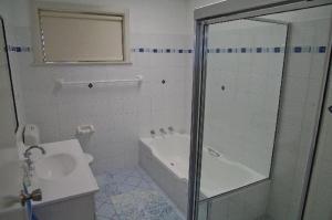 
A bathroom at Charm Cottage, 58 Skyline Crescent
