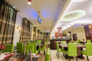 A restaurant or other place to eat at Grand Pela Hotel & Suites