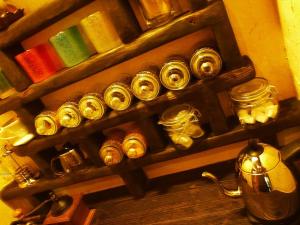 a bunch of different types of clocks on a shelf at Taketomijima Akaneya in Taketomi