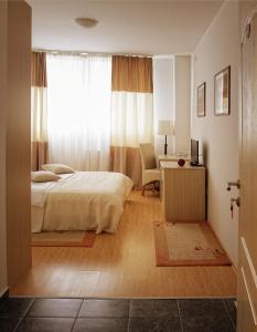 Giường trong phòng chung tại Garni Hotel Hamburg