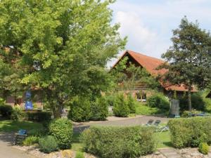 a view of a house with trees and bushes at Holiday Home in Germany with Garden Terrace in Bredenborn