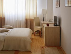Giường trong phòng chung tại Garni Hotel Hamburg
