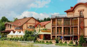 a group of buildings on the side of a street at Hotel Kilikiya in Uzhhorod