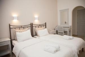Posteľ alebo postele v izbe v ubytovaní Pelican Hotel