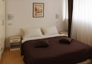 Giường trong phòng chung tại Garni Hotel Hamburg