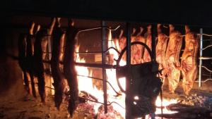 a bunch of meat is cooking in an oven at Il Frutteto in Sant' Isidoro