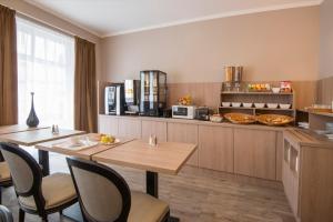 Kuchyň nebo kuchyňský kout v ubytování Hotel Paganini