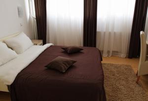 Giường trong phòng chung tại Garni Hotel Hamburg