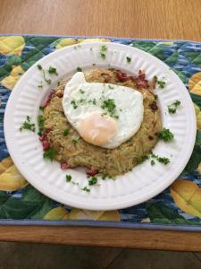 a plate with a fried egg on top of rice at Caragh Glen B&B in Killorglin