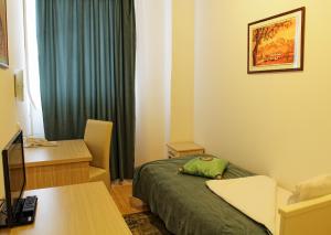Giường trong phòng chung tại Garni Hotel Hamburg