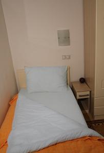Giường trong phòng chung tại Garni Hotel Hamburg