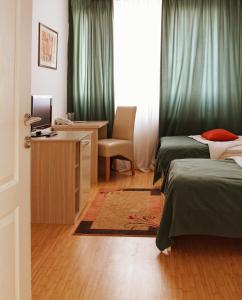 Giường trong phòng chung tại Garni Hotel Hamburg