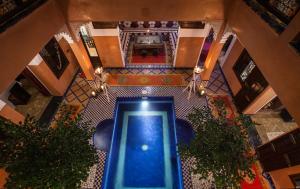 an overhead view of a pool in a building at Riad Alaka in Marrakesh