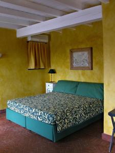 A bed or beds in a room at Agriturismo Natta Di Monte Tabor