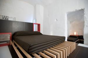 Postelja oz. postelje v sobi nastanitve Basiliani Hotel