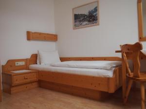 Postel nebo postele na pokoji v ubytování Tischlerwirt