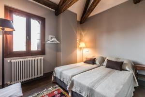 Posteľ alebo postele v izbe v ubytovaní Ca' Del Pittore Terrace