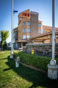 a hotel building with a fireplace in front of it at Monte Carlo Inn Barrie in Barrie