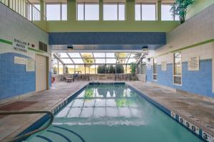 a pool in a building with a swimming pool at Monte Carlo Inn Barrie - Newly Renovated in Barrie