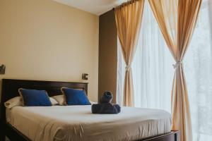 מיטה או מיטות בחדר ב-Casa de Lis Hotel & Tourist Info Centre