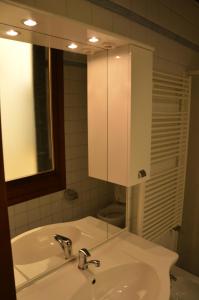 a bathroom with a white sink and a mirror at Lovely Apartment In Venice in Venice