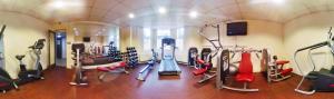 a gym with treadmills and cardio equipment in a room at Halpin House (South Kensington) in London