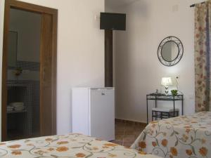Postel nebo postele na pokoji v ubytování Hostal El Canario