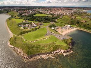an aerial view of a small island in the water at The Tynemouth Cottage in Tynemouth