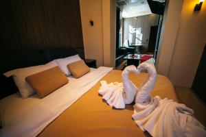Postel nebo postele na pokoji v ubytování Hotel Fortuna
