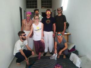 a group of people posing for a picture in a room at Veera's Hostel in Pushkar