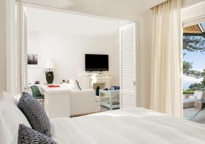 A bed or beds in a room at Hotel La Minerva