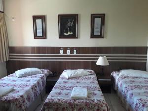 Säng eller sängar i ett rum på San Marino Hotel