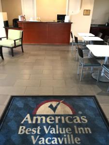 an americas best value inn vacancy sign on a rug in a dining room at Americas Best Value Inn Vacaville in Vacaville