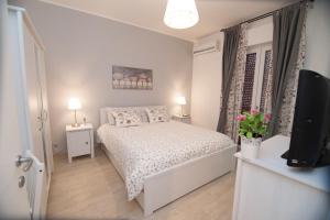 Postel nebo postele na pokoji v ubytování Borgo Antico Home