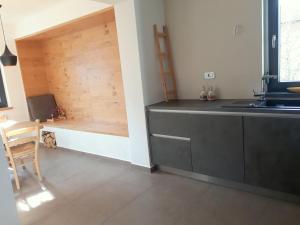 Kuchyň nebo kuchyňský kout v ubytování Apartments ALPA VITA